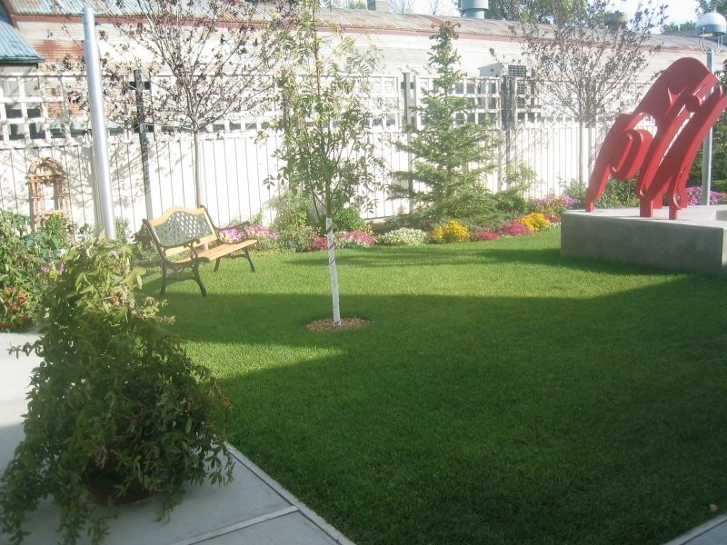A landscaped sculpture courtyard invites visitors to enjoy the outdoors, Shurniak Art Gallery - Assiniboia, SK.