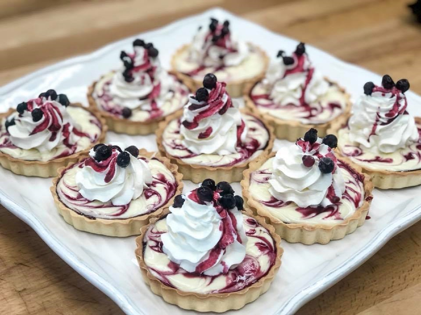 Mini Saskatoon berry cheesecakes